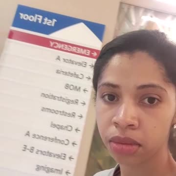 Part 9. First floor sign with pretty artwork behind me (I'm standing in front of it. My bad)