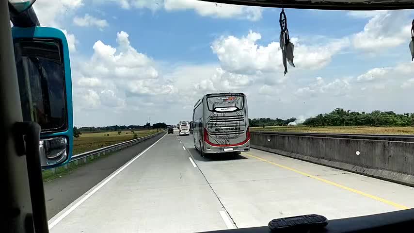 Convoy of five buses on the Indonesian toll road