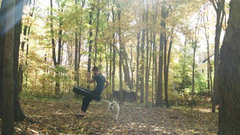 A man and his dog in a woodland