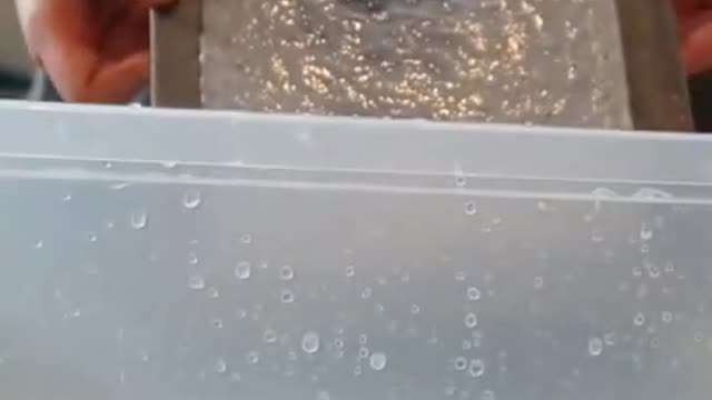 Paper Pulp Crumbles As Person Shakes Wet Sheet With Pressure