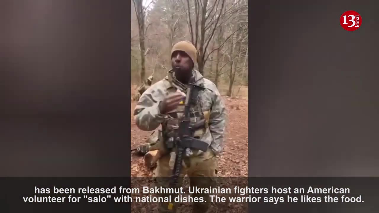 Ukrainian soldiers host an American soldier with their national meal