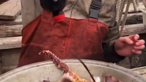Chinese man eating seafood.