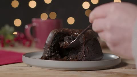 Close Up Shot of Hand Using Fork to Take Piece of Christmas Chocolate Cake-A close-up shot of a hand