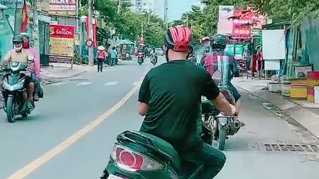 The young man driving a strange motorbike looks like it's broken in two