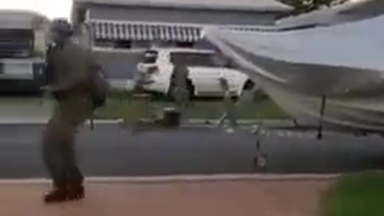 Armed soldiers patrol Australian street