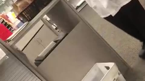 Woman politely asks a CVS pharmacist to pull a Moderna safety insert from package.