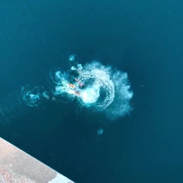 Boys perform a mass jump