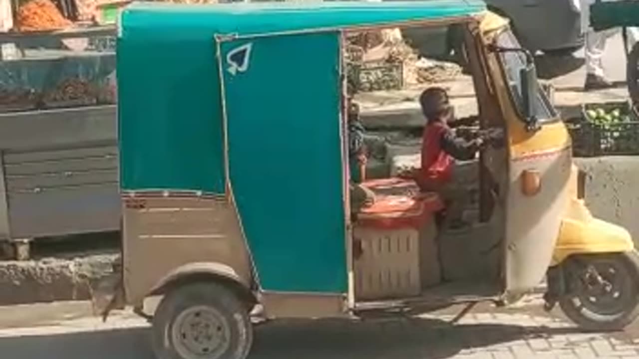 Baby try to drive Tuk Tuk Rikshaw