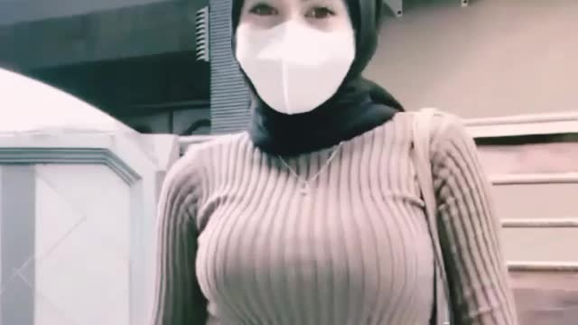 beautiful girl in hijab dancing