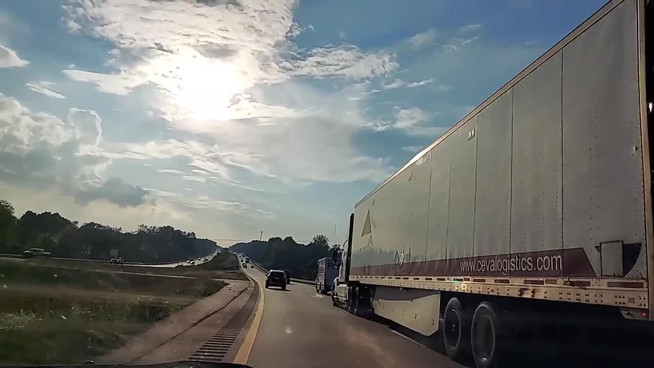 Truck Turning Into Car Lane as It Attempt to Overtake It