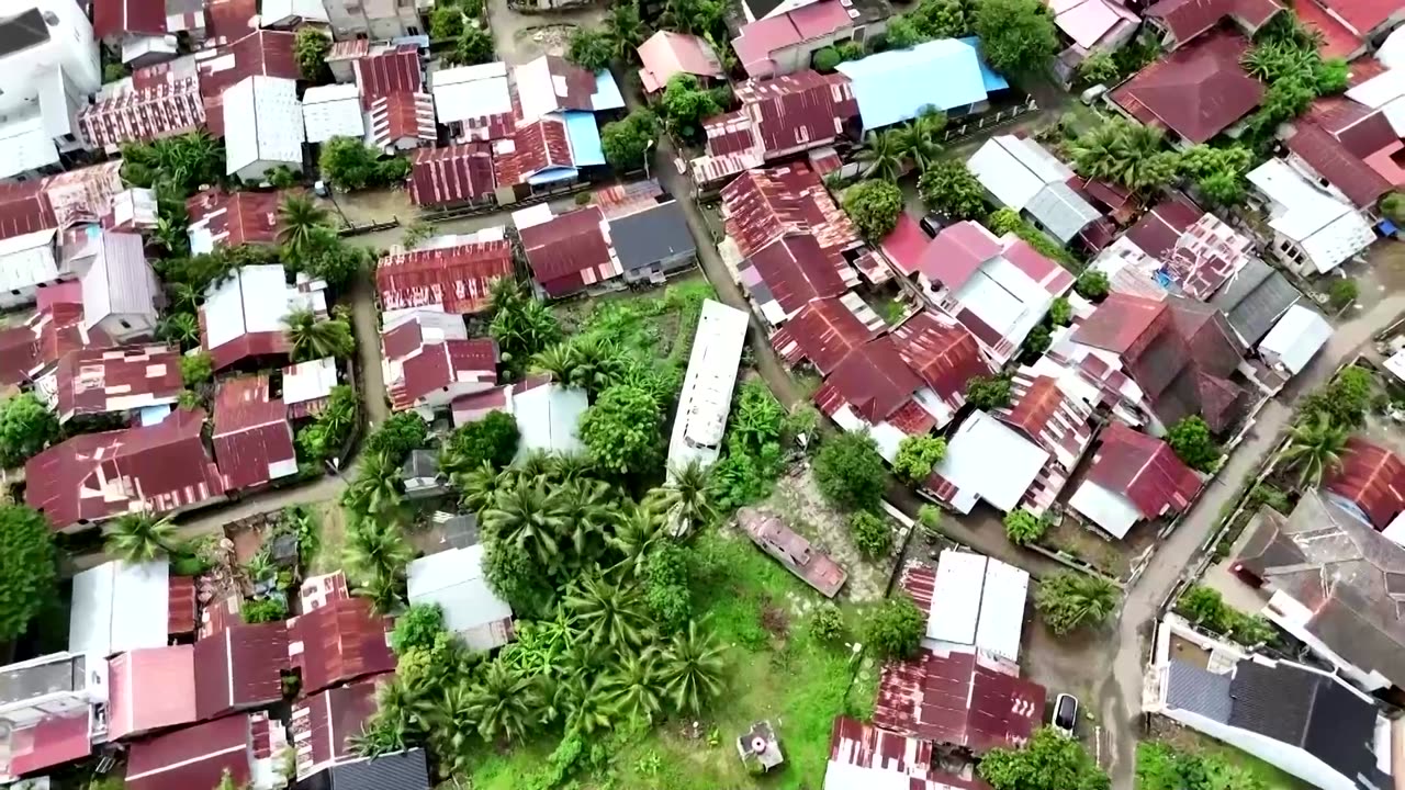 Indonesian tsunami survivor waits for son to return, two decades on