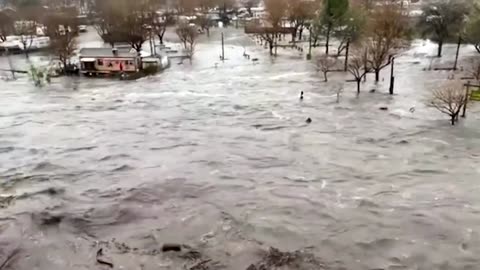 Floodwaters encircle California homes