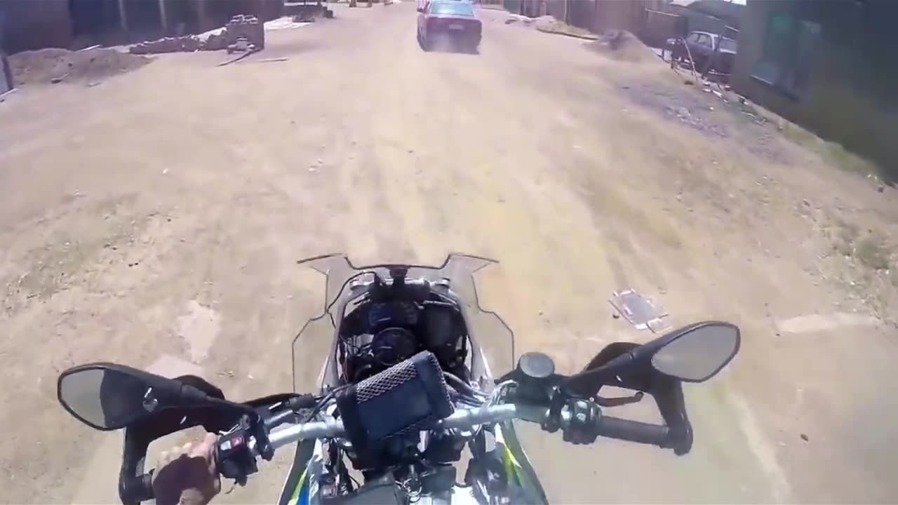 South African Cop shoots on car from his motocycle