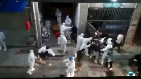 Crowd escapes from housing complex lockdown in Shanghai.