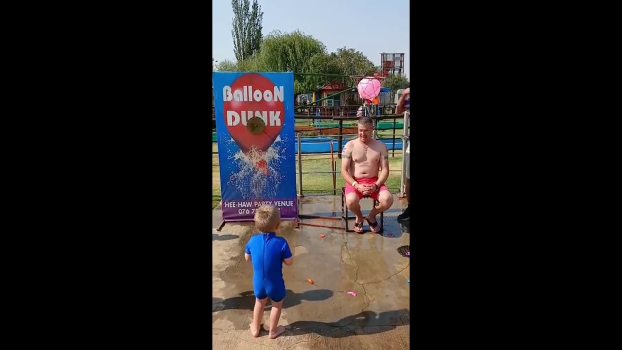 Energetic kid makes the perfect balloon dunk shot