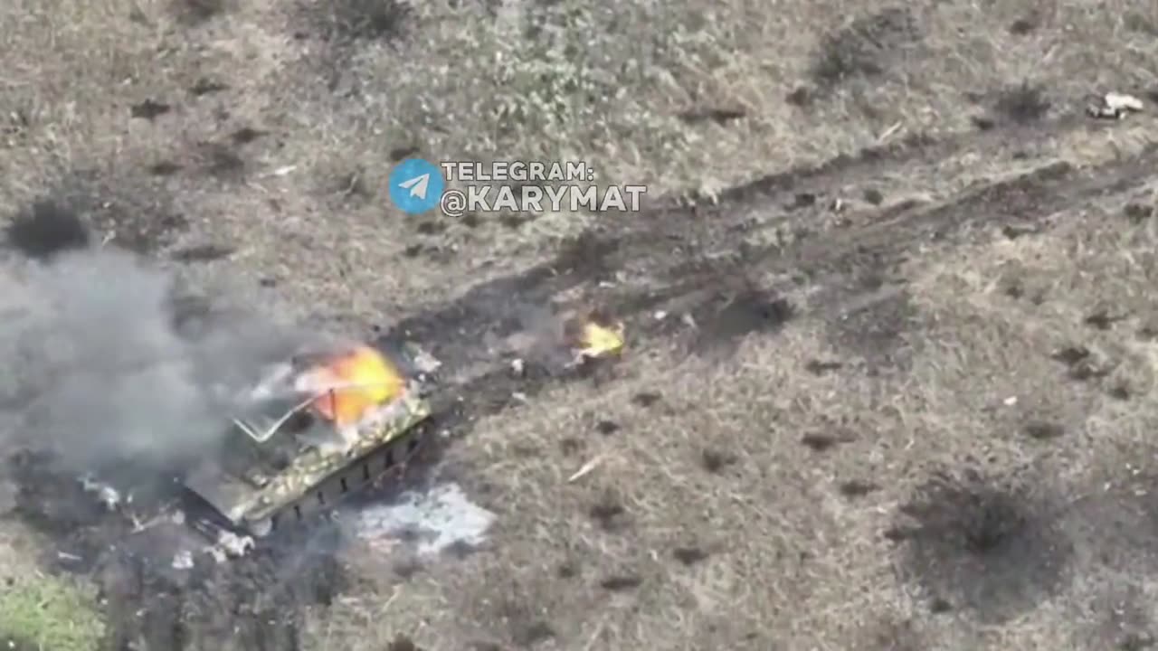 Covered in fire, a Russian soldier jumps out of his MT-LB