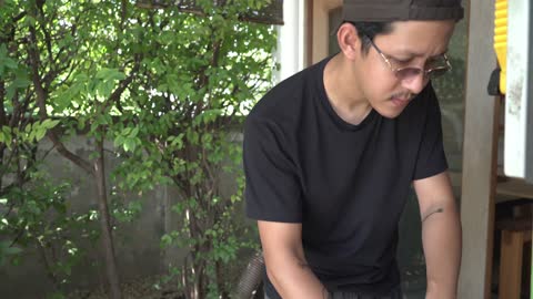 A Man Cutting Wood 2