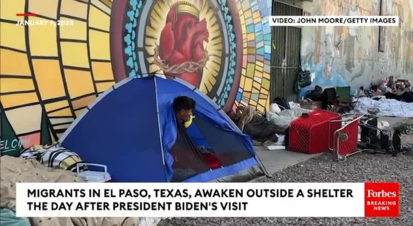 Migrants wake up outside a migrant shelter one day after President Biden paid a visit there