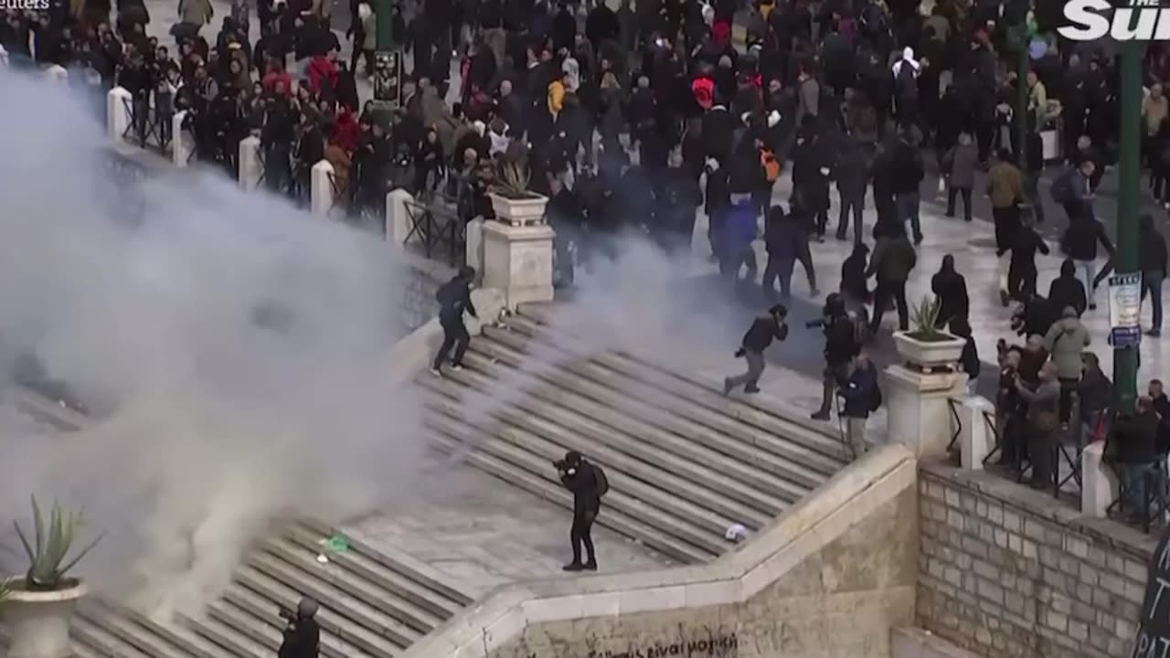 Riot police use to your gas on protesters in violent clash of a train crash in Greece