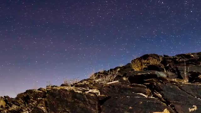 with the pen between his fingers