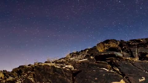 with the pen between his fingers