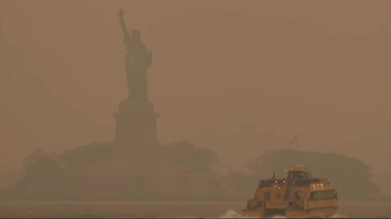 Statue of Liberty seen through smoky wildfire haze in NYC