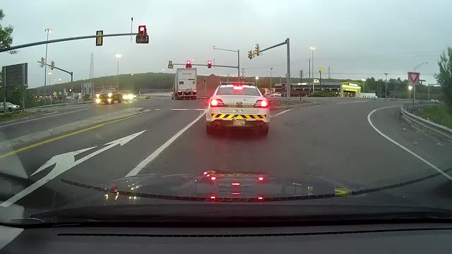 Truck driver runs red light - immediately gets pulled over