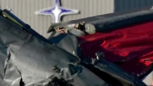 Spectators watched in horror as two vintage planes collided midair in the skies above Dallas