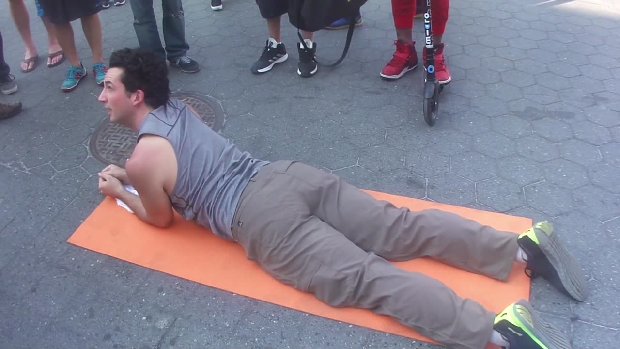 Luodong Massages White Man In Grey Shirt On Sidewalk