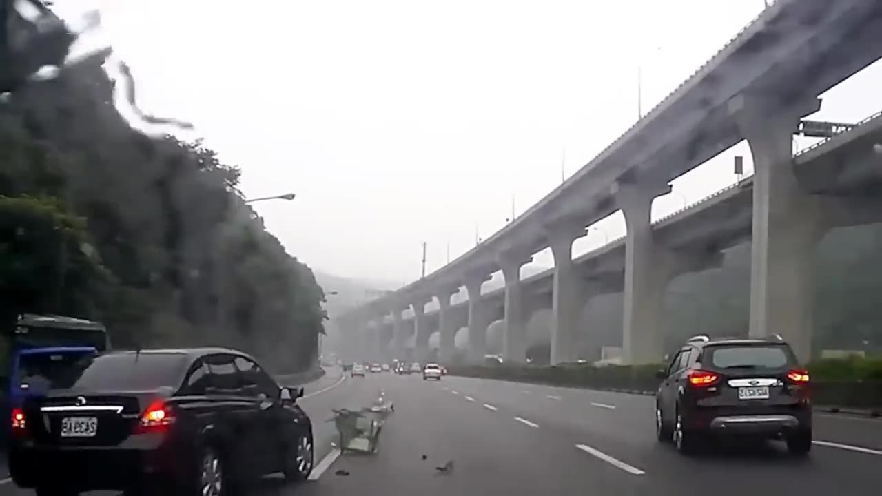 Windy Rainy Day in China Blows Small Truck around like Feather