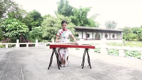 Breathtaking Guzheng Performance in a Traditional Chinese Landscape