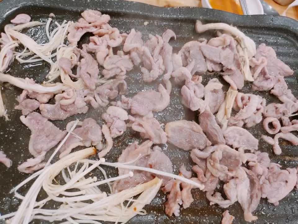 Korean duck meat on a griddle