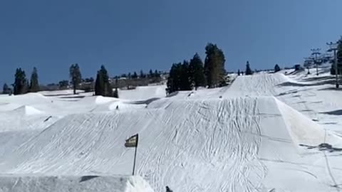 Snowboarder Faceplants in Snow After Flipping Off Snow-Ramp