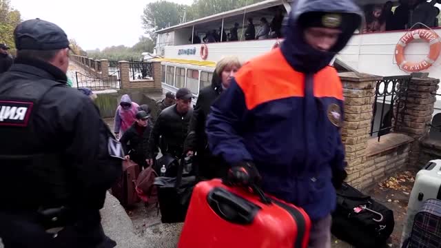 Civilians evacuated from Kherson dock in Oleshky