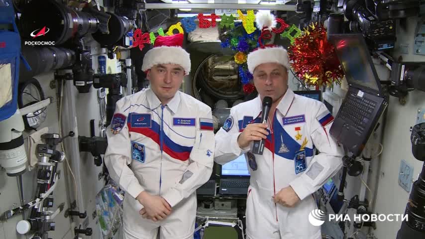 Cosmonauts Anton Shkaplerov and Pyotr Dubrov wish a Happy New Year from the ISS