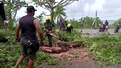 Colombian police help fix homes wrecked by storm Julia