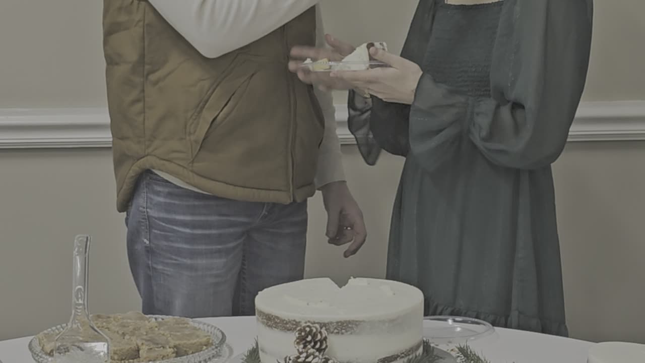 JB & K Cutting Wedding Cake