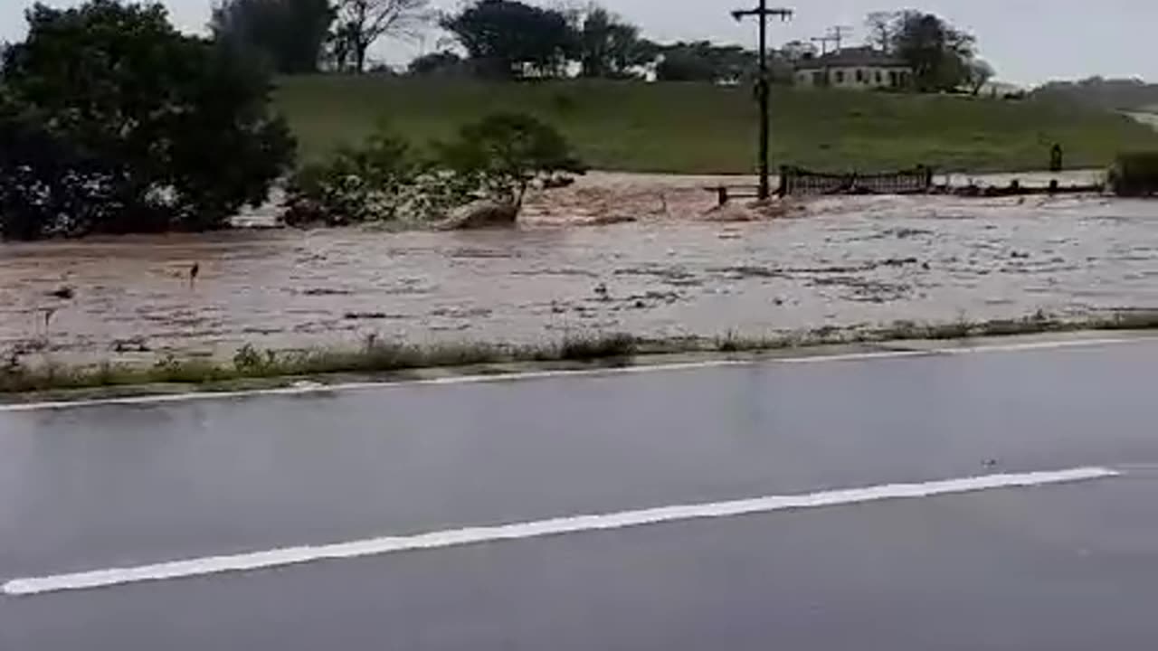 Flood in Camaqua Brazil take a police car away