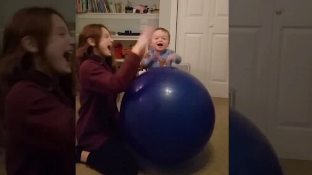 Baby playing with his sister.