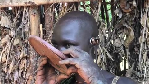 The lady from suri tribe inserting lip plate