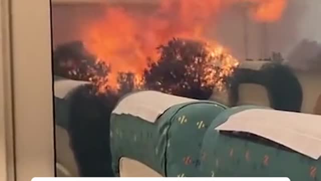 Train flanked by wildfire during unscheduled stop