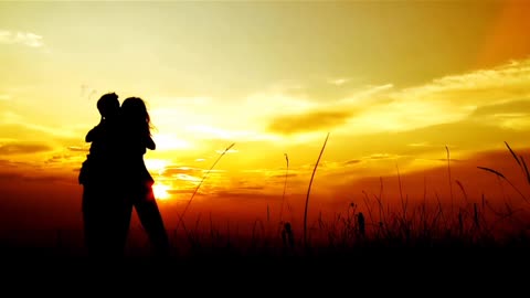 The couple dances in The sunset.