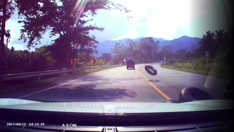 Precariously Stacked Tires Fall Off Truck