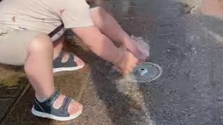 Toddler Surprised By Fountain