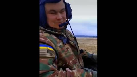 Ukrainian fighters, an American flag on the shoulder