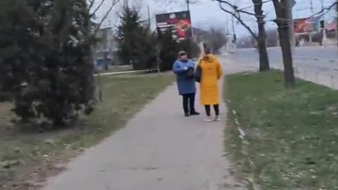 In Kherson, locals watch Russian soldiers in the city on their way to work