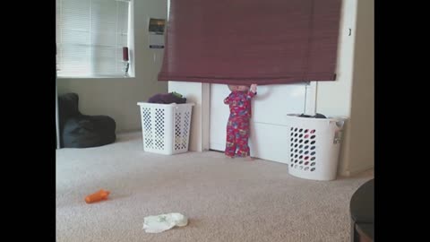 Super baby disapears behind curtain