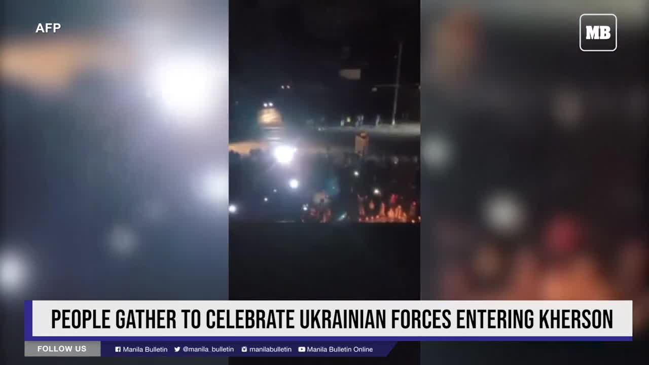 People gather to celebrate Ukrainian forces entering Kherson