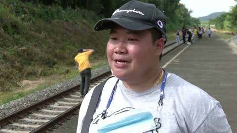 'Floating train' passing through one of Thailand's largest reservoirs, a big hit as dam waters rise