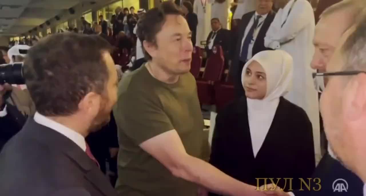 Elon Musk Shares a Very, VERY Long Handshake with Turkish President